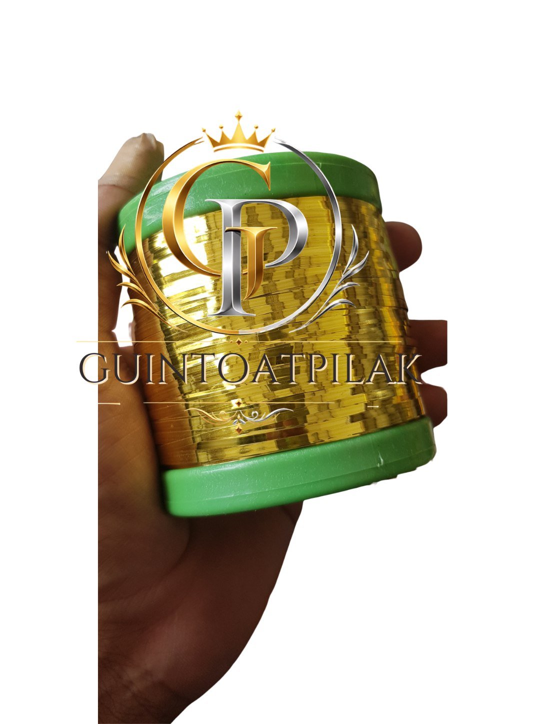 Flat Thread #2 Gold spool with green end held in hand